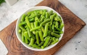 Defrost the frozen green beans the day before, put in a sieve to drain excess moisture.