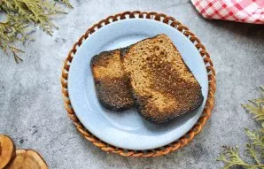 Burn half of the bread with a burner.