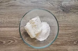 Put cottage cheese in a bowl, add powdered sugar, mix.