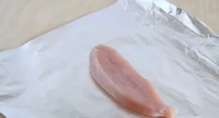 We will cook each slice of fillet separately. Tear off a piece of foil about 22 x 22 cm in size, grease the foil with oil and put a piece...