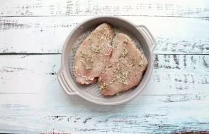 Rinse and dry the briskets. Mix grated garlic with salt, pepper and Provencal herbs. Rub the brisket with the mixture and put it in a gre...