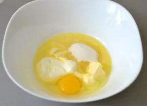 Add sour cream, egg, sugar and salt to soft butter.