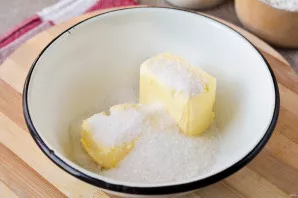 Pour butter and sugar at room temperature into a bowl. If your butter has not yet melted, melt it in the microwave.