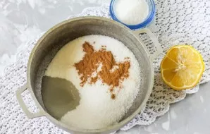 Pour the sugar into a saucepan with a non-stick bottom. Pour lemon juice, add ground cinnamon. Pour warm water and place the container on...