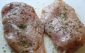 Coat the chicken breast with olive oil and sprinkle with spices on all sides.
