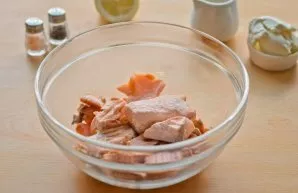 Put fresh salmon in a saucepan with boiling water and cook for 10 minutes over medium heat. Then transfer the cooked fish to a deep bowl....