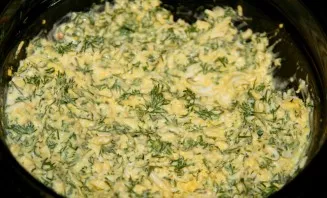 For the second filling, boiled eggs need to be grated on a fine grater, add chopped dill and mayonnaise.