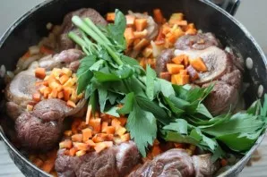 Add chopped carrots and sprigs of viburnum.