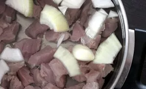 Pour the meat with water, add half a clove of peeled, coarsely chopped onion and garlic and cook until the meat is cooked. Do not forget ...