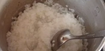 Cook rice until half cooked.