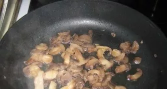 Wash and peel the mushrooms. Pour a little odorless vegetable oil into the pan and heat well. Cut the champignons into small pieces or sl...