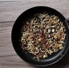 Finely chop the bacon and fry in half the butter until gently browned. Peel the onion and garlic, cut as thinly as possible and add to th...