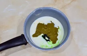 Pour the milk into the pot and add the butter. Put pistachio paste and green. Put on the fire and bring to a boil. Pistachio paste is ver...