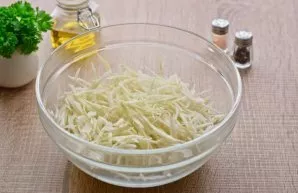 Wash the cabbage and remove the upper leaves. Then cut the cabbage into thin strips. You can chop the cabbage with a knife or a special g...