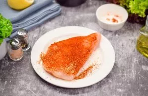 Rub the chicken fillet with spices  paprika, garlic, salt and pepper. Leave to marinate for 30 minutes.