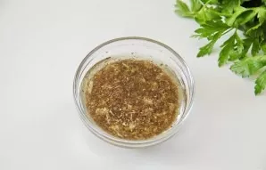 Rinse the lemon well and remove the zest. Squeeze all the juice from the lemon and add the grated zest, garlic, olive oil, oregano, salt ...