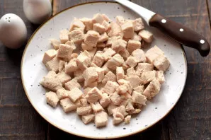 Boil the chicken fillet in salted water until soft. Approximate cooking time is 15 minutes after boiling water. Cool the cooked meat comp...