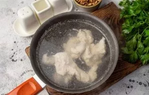 Cut the chicken fillet into pieces, dip in boiling, salted water, reduce the heat to a minimum and cook until tender, about 15-20 minutes...