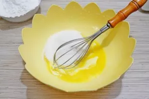 Beat very soft butter with sugar.