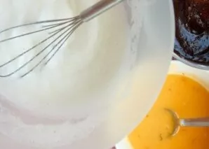 Melt the contents of the pot with chocolate over low heat. Whip the proteins until stiff. Mix the yolks with grated orange peel, orange j...