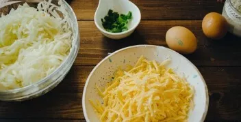 Peel the zucchini and grate on a coarse grater. Season with salt and pepper, leave for ten minutes, and after this time squeeze out exces...