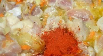 Add chopped pork and sprinkle with paprika. Stir, fry for another 10 minutes.