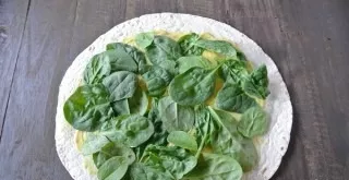 Spread the washed and drained greens in an even layer.