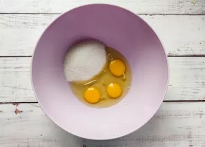 Beat eggs in a bowl, add sugar.