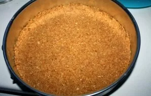 Mix the butter well with the crumbs. Put baking paper in the form under the cake (cut out according to the diameter of the form). Put the...