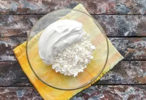 Mix cottage cheese with sour cream.