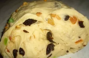 Put the kneaded dough in a warm place and cover with a towel. It should rise after a couple of hours. Then add candied fruits. You can al...