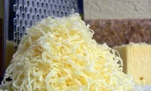 Grate the cheese on a coarse grater.