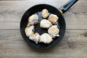 Wash the chicken, dry it and cut it into pieces. Pour vegetable oil into the pan, heat over high heat and fry the chicken pieces on both ...