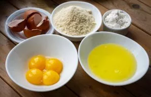 Carefully separate the egg whites and yolks into separate containers.