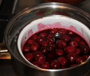 Put the cherries in boiling water in a bowl.