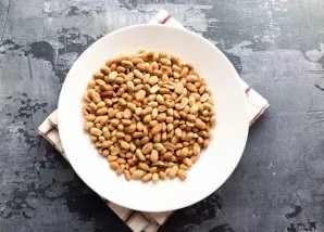 Peel the roasted peanuts.