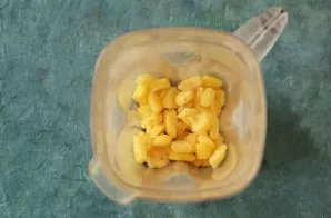 Grind the pineapple in a blender along with syrup and xanthan gum.