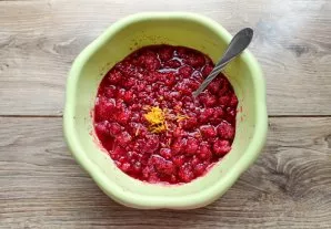 Grate the lemon zest and put in a bowl with berries and sugar.