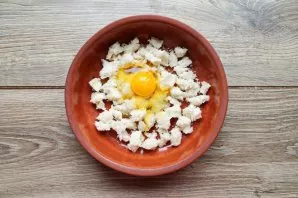 Put the crumbs in a bowl and beat the egg.