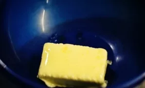 Soften the butter in the microwave or in a water bath. It should be soft, not liquid!