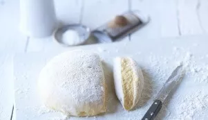 Mix potatoes with egg yolks and flour.