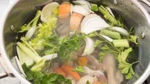 Wash the bones and return them back to the saucepan, put 2 carrots, coarsely chopped, 2 celery stalks, coarsely chopped onion, pepper pea...