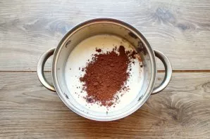 Remove the pot from the heat, add cocoa powder and mix well until smooth.