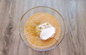 Add sour cream to the bowl and mix until smooth.