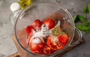 Add salt, sugar, dried oregano to the tomatoes. Pour in olive oil.