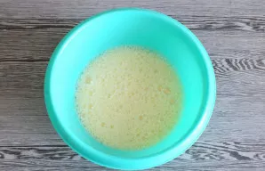 Beat until fluffy, homogeneous mass. Set aside 2 tablespoons of condensed milk. Pour the remaining milk into the bowl with the beaten egg...