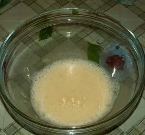 Beat the egg until frothy.