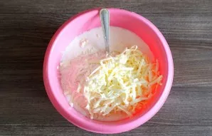 Add flour, grate cold margarine.