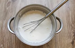 Bring the remaining milk to a boil over low heat in another saucepan. With intensive whipping, pour in the egg mixture. Stir until smooth.