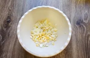 Boil one egg, cool and peel. Finely chop and put in a bowl.
